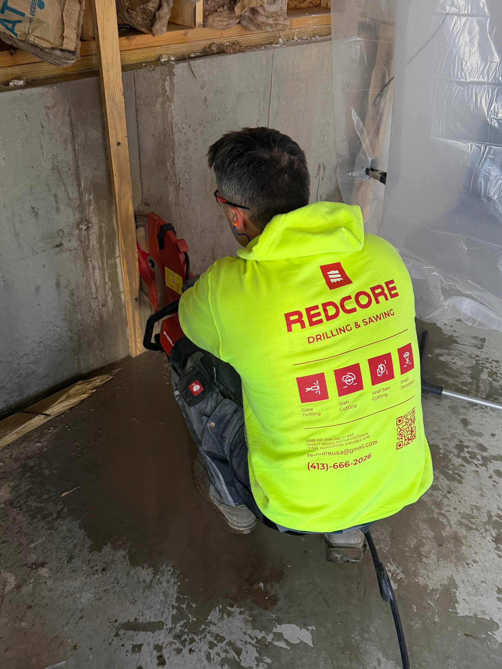 Hand saw cutting concrete wall
